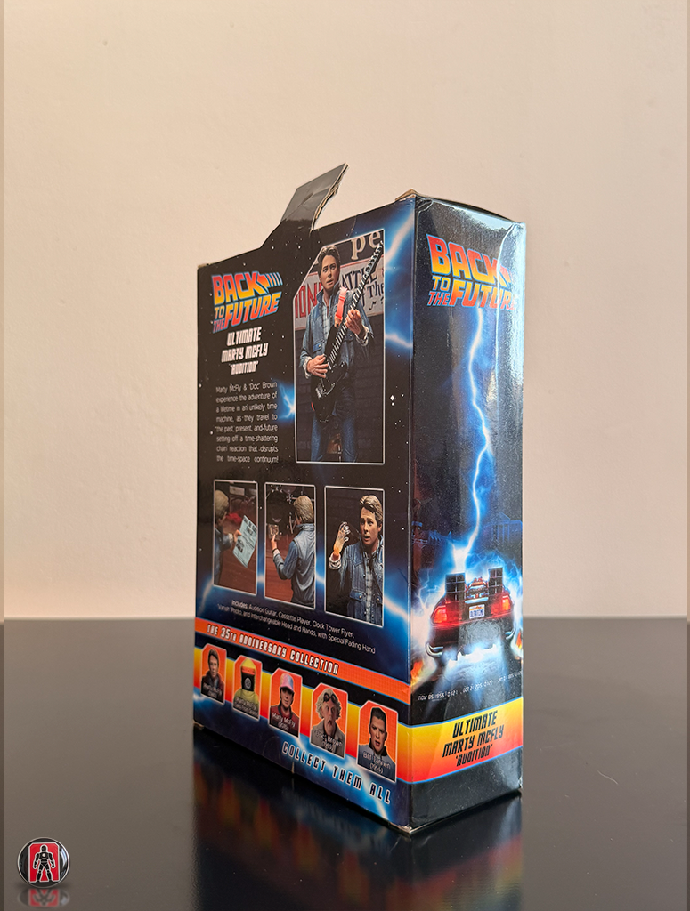 Figura de acción definitiva de NECA: Marty McFly con guitarra de la película Regreso al Futuro II