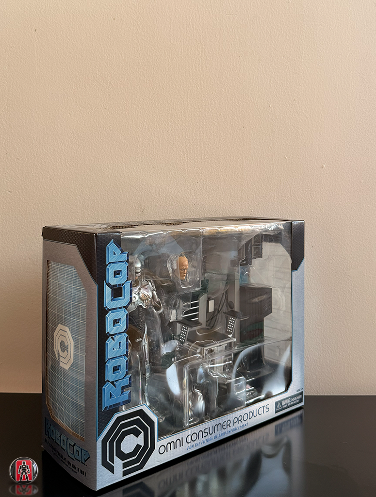 NECA Robocop Ultimate con Daños de Batalla y Silla 18cm