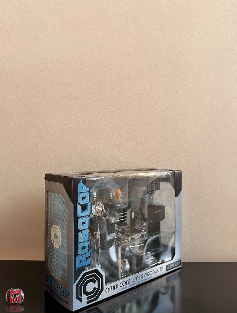 NECA Robocop Ultimate con Daños de Batalla y Silla 18cm