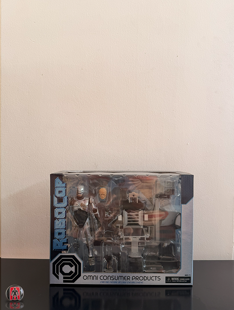 NECA Robocop Ultimate con Daños de Batalla y Silla 18cm